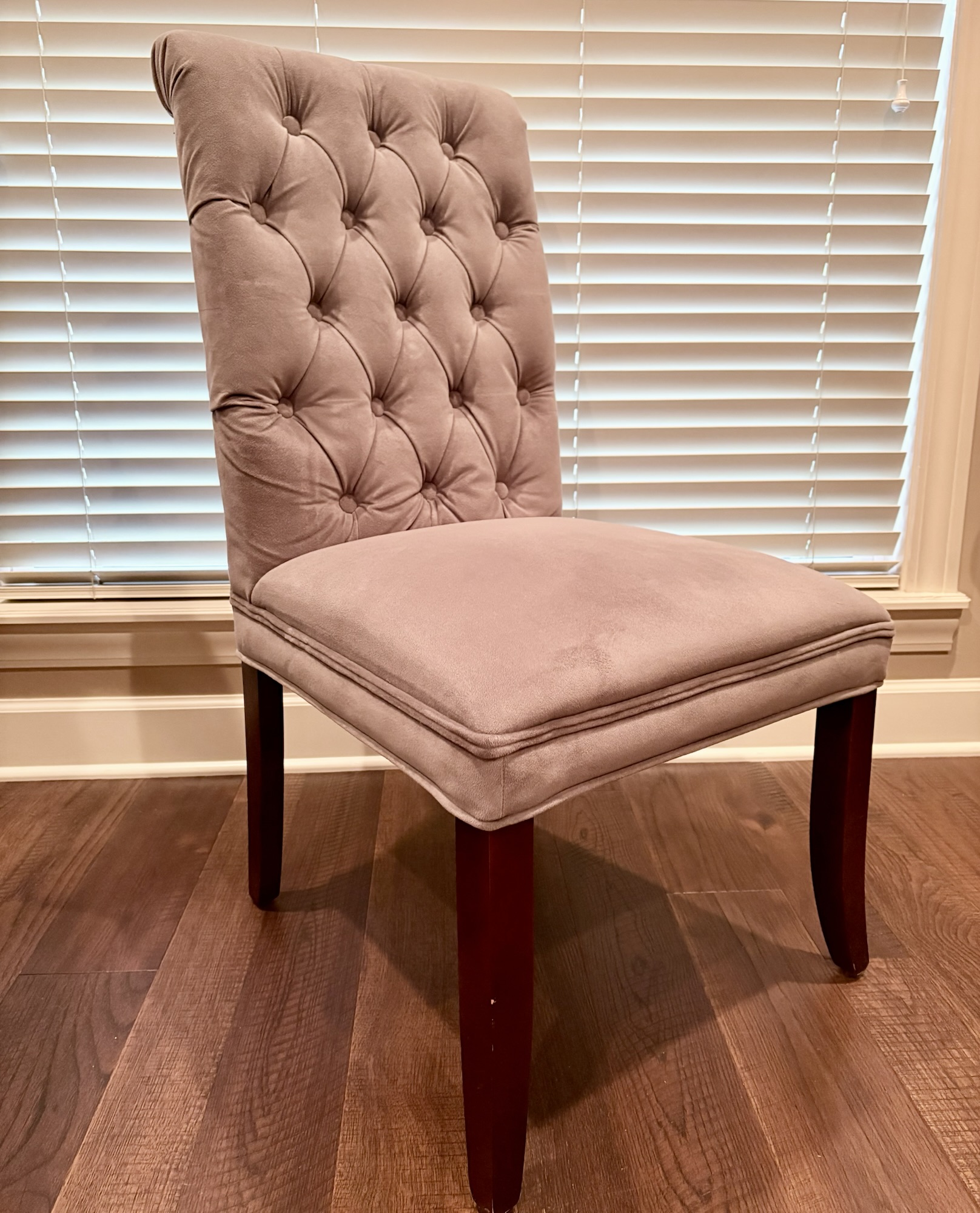 A gray velvet chair